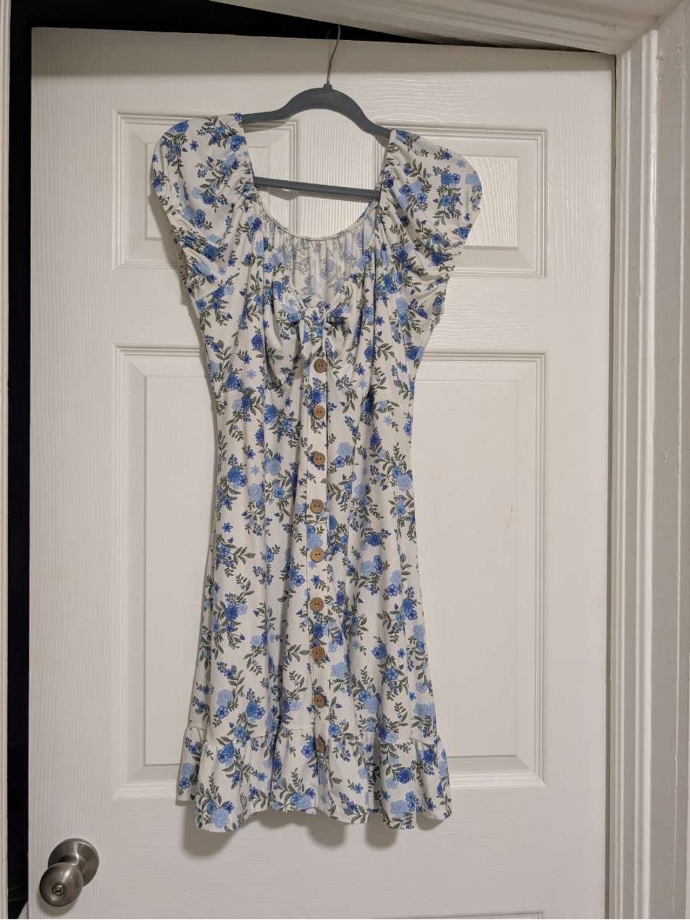 White Floral faux Button-Front Sundress with Blue Flowers and green leafy accent